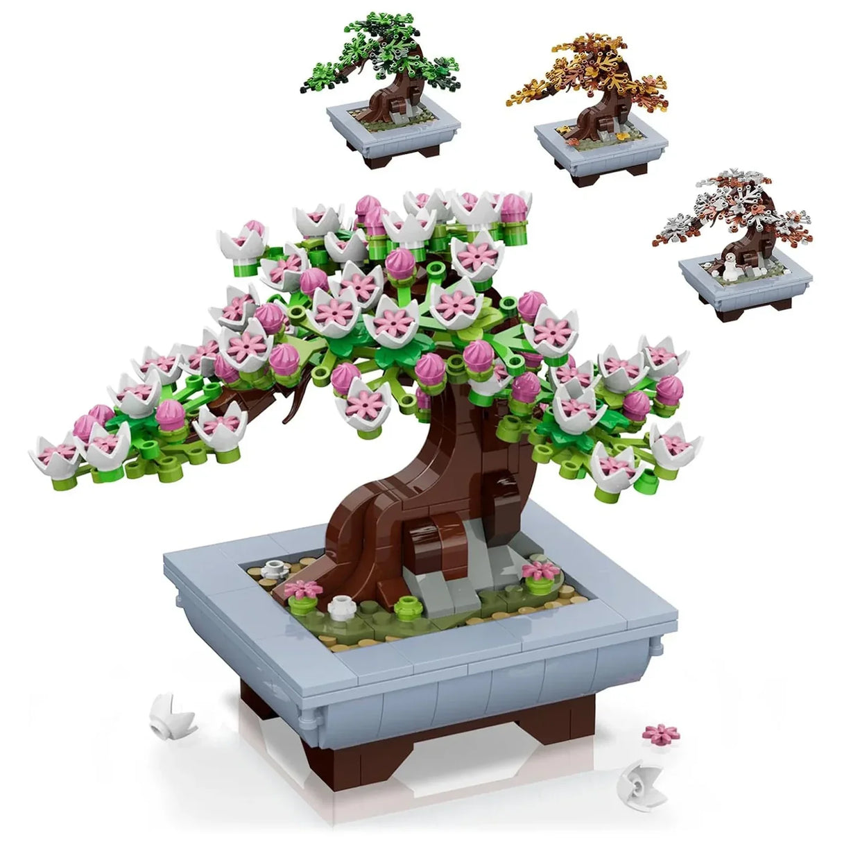 Ein Bonsai-Baum aus Bausteinen mit rosa und weißen Blüten, umgeben von drei weiteren Bonsai-Bäumen