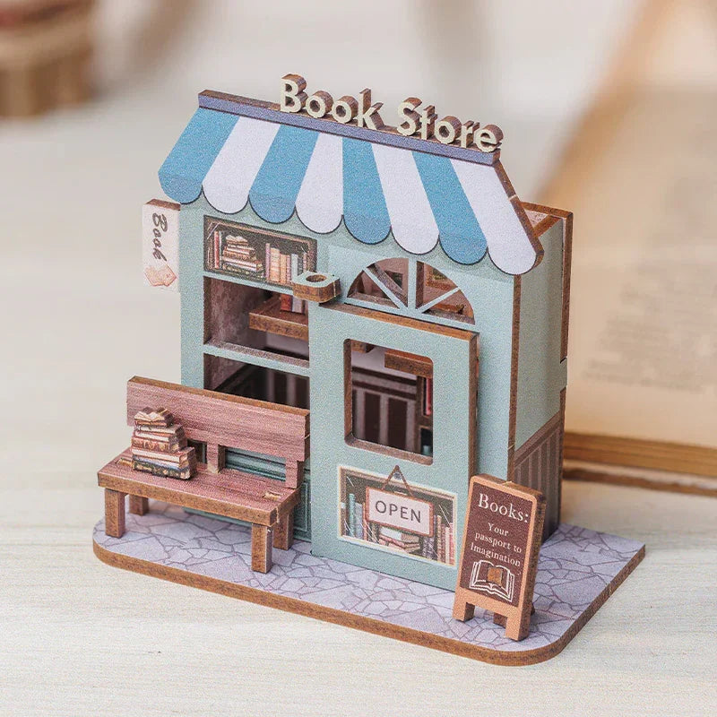 Miniatur-Buchladen-Modellbausatz mit blauer Markise und Bank