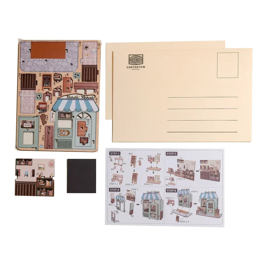 Bastelset für ein Miniatur-Bücherregal mit Postkarten und Anleitung