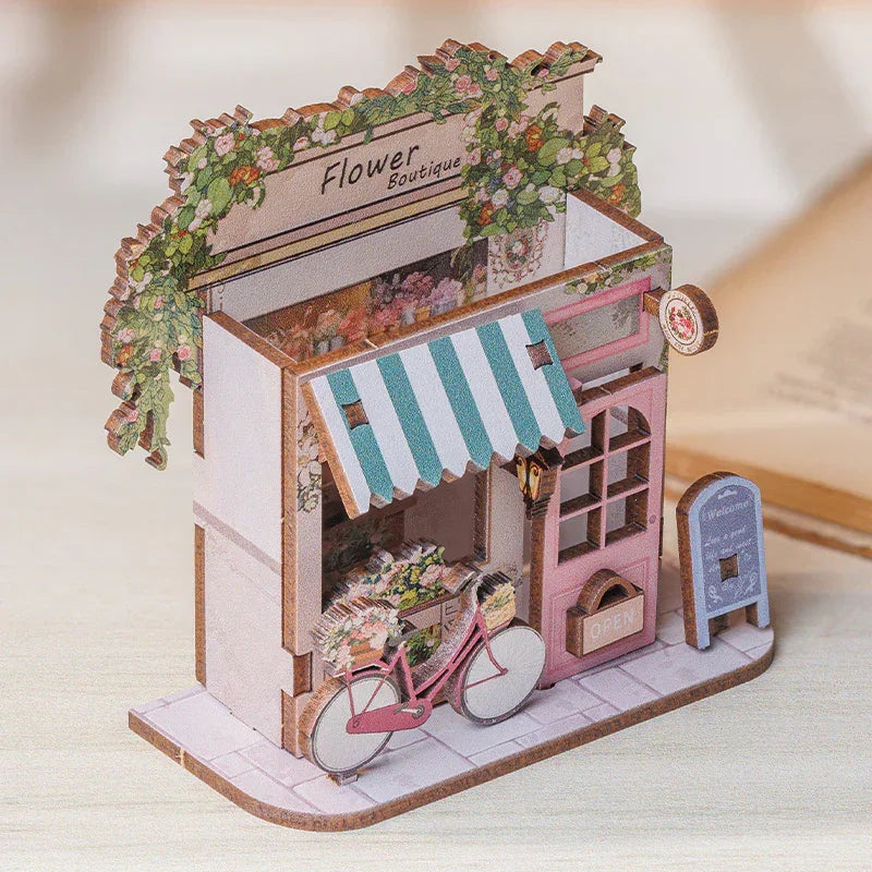Miniatur-Blumenboutique aus Holz mit Markise, Fahrrad und Blumen