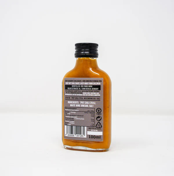 Rückseite der 7 Pot Puro Chilisauce mit Zutatenliste 7Pot Chili 75%, Weissweinessig, Salz sowie Nährwertangaben und Vegan-Symbol