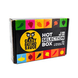 Crazy Bastard Sauce Hot Selection Box mit 12 Mini Hot Jars, schwarze Geschenkbox mit bunten Chili-Motiven