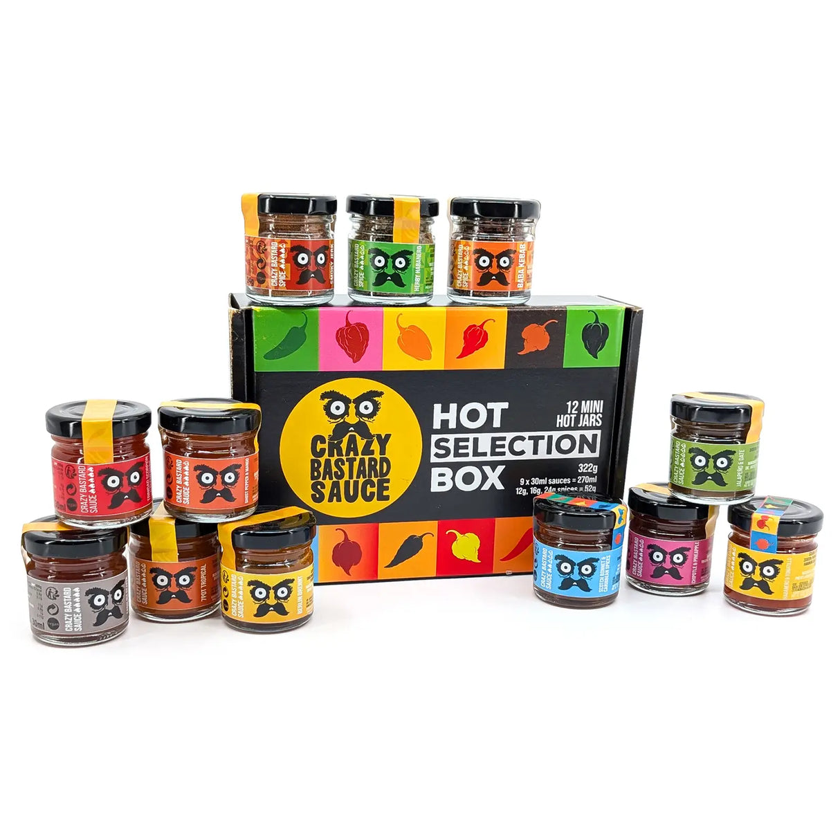 Crazy Bastard Sauce Selection Box mit 12 geöffneten Mini-Gläsern, 9 Chili-Saucen und 3 Gewürzmischungen um die Verpackung arrangiert